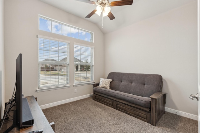 sitting room with vaulted ceiling, carpet flooring, and ceiling fan