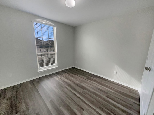 empty room featuring dark hardwood / wood-style floors