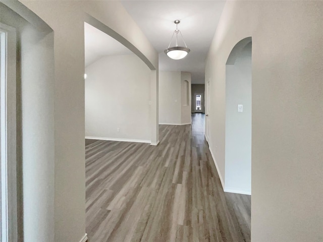 corridor with wood-type flooring