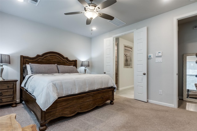 bedroom featuring light colored carpet and ceiling fan