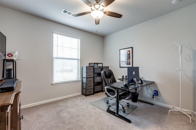 office space with light colored carpet and ceiling fan