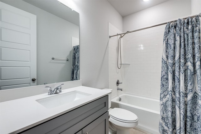 full bathroom with vanity, shower / bath combination with curtain, and toilet