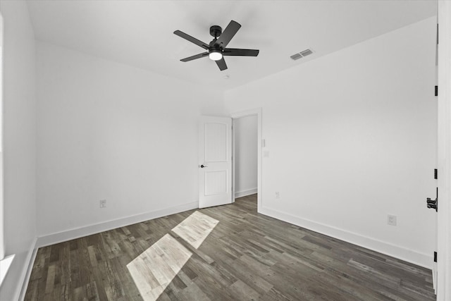 unfurnished room featuring dark hardwood / wood-style floors and ceiling fan