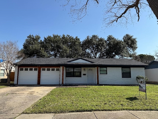 ranch-style home with a garage and a front yard