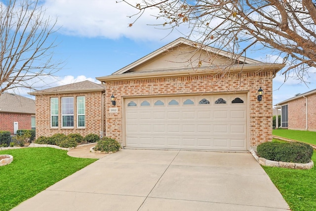 view of front of house with a garage and a front lawn