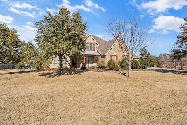 view of front of home with a front lawn