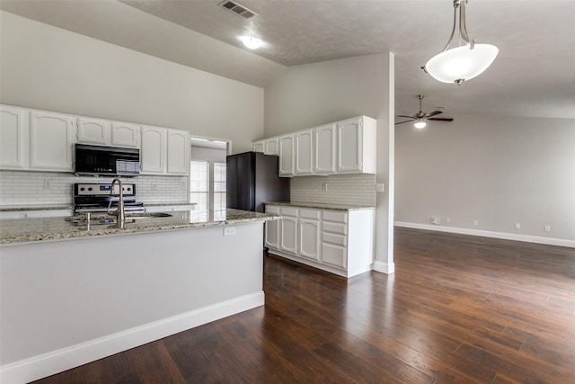 kitchen with pendant lighting, white cabinets, ceiling fan, light stone countertops, and stainless steel electric range