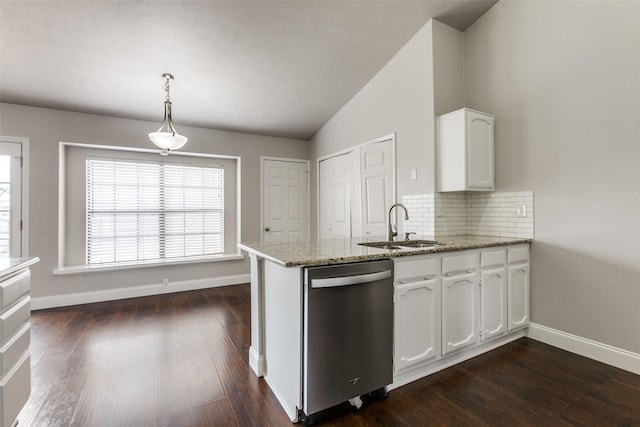 kitchen featuring pendant lighting, white cabinetry, sink, stainless steel dishwasher, and kitchen peninsula