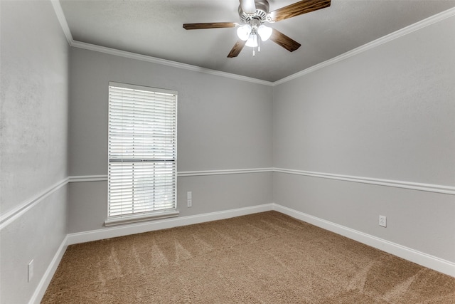 unfurnished room with crown molding, carpet flooring, and ceiling fan