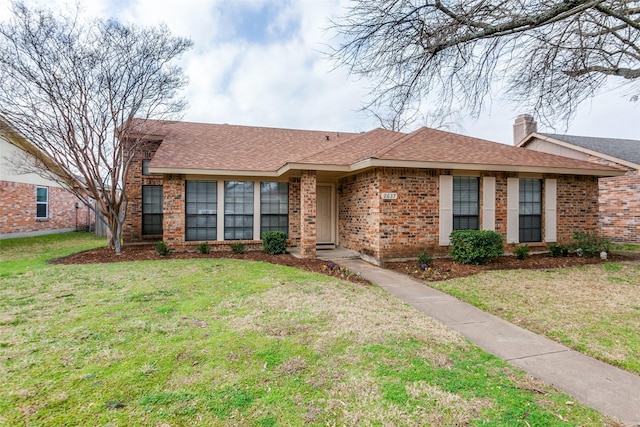 ranch-style house with a front lawn