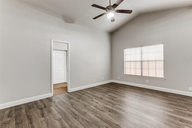 empty room with wood-type flooring, ceiling fan, and vaulted ceiling