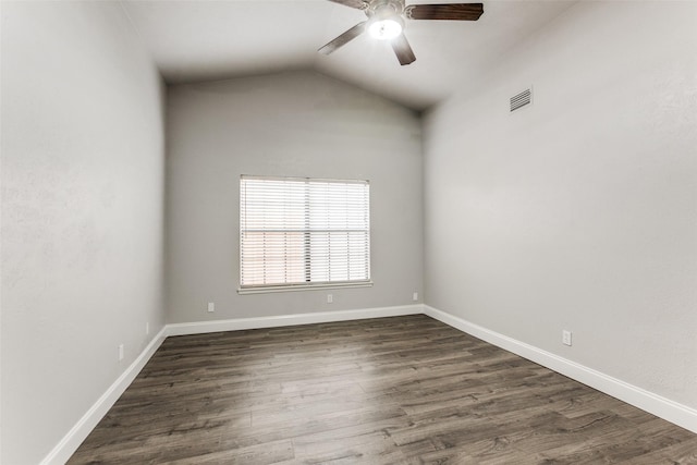 unfurnished room featuring lofted ceiling, dark hardwood / wood-style floors, and ceiling fan