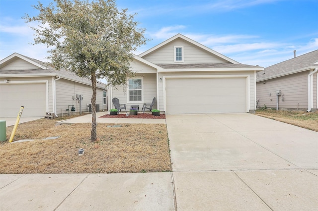 view of front of home with a garage and concrete driveway