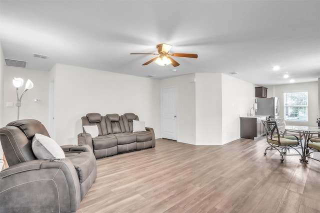 4322 Johnstown Ln, Forney, TX 75126 - living room with a ceiling fan and light wood-style floors