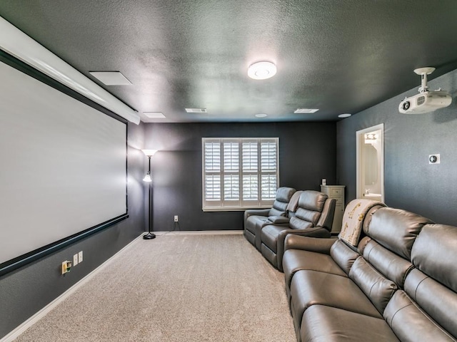 carpeted cinema room with a textured ceiling