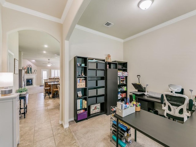 office area with ceiling fan, ornamental molding, and light tile patterned floors