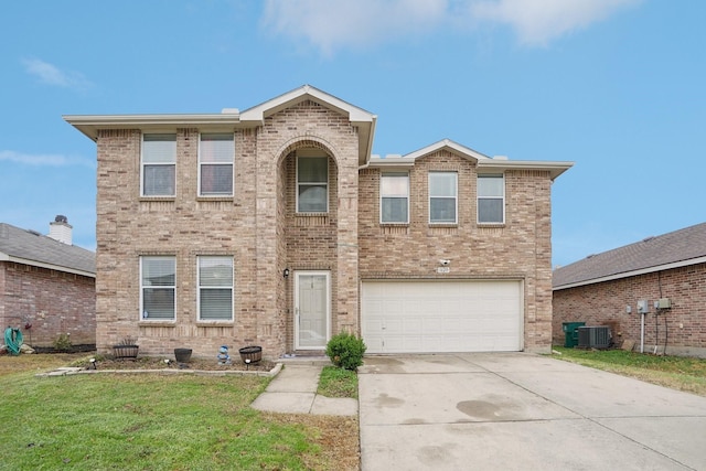 view of front of house with a garage and a front lawn