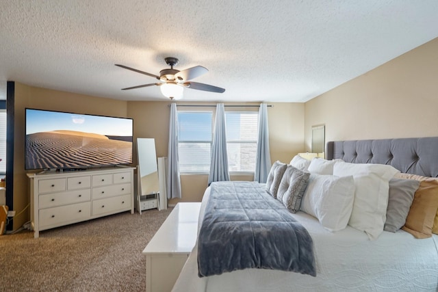 bedroom featuring a textured ceiling, ceiling fan, and carpet flooring