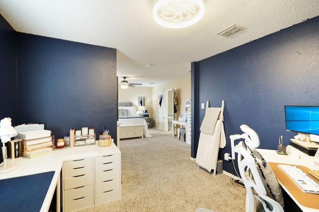 interior space featuring ceiling fan and a textured ceiling