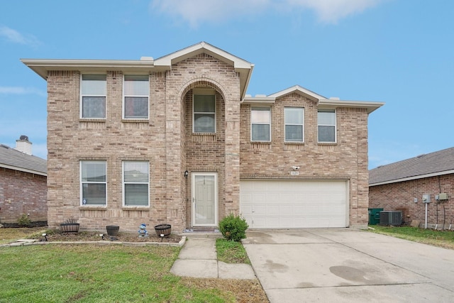 view of front of home with central AC unit, a garage, and a front yard