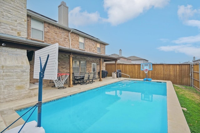 view of pool featuring a patio