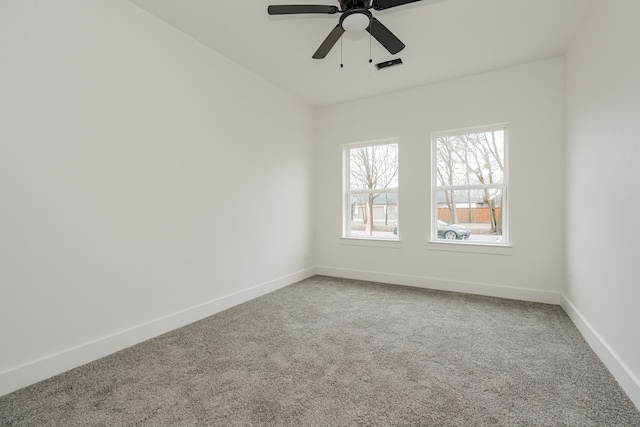 carpeted empty room with ceiling fan