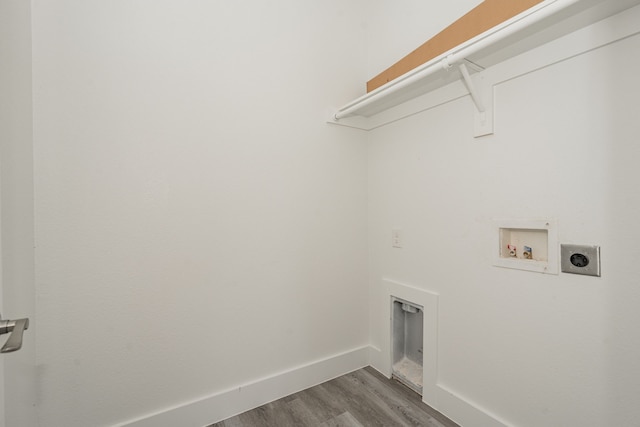 clothes washing area with washer hookup, dark hardwood / wood-style floors, and hookup for an electric dryer