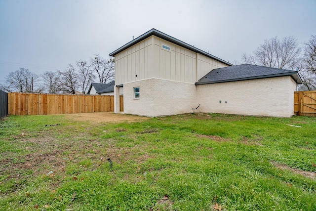 view of property exterior with a yard