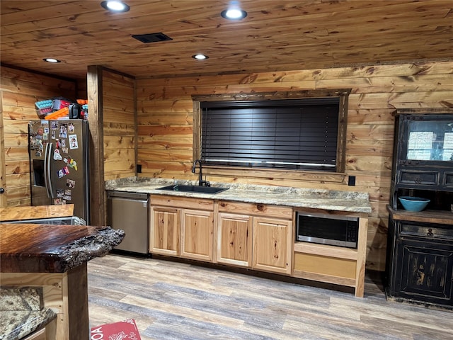 bar featuring sink, stainless steel appliances, light stone countertops, wooden ceiling, and light hardwood / wood-style flooring