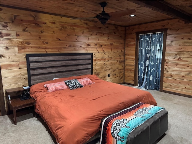 carpeted bedroom with wood ceiling and wood walls