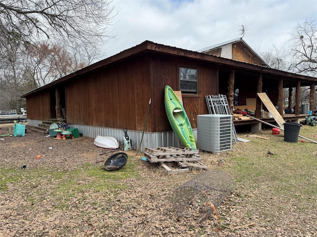 view of home's exterior with cooling unit