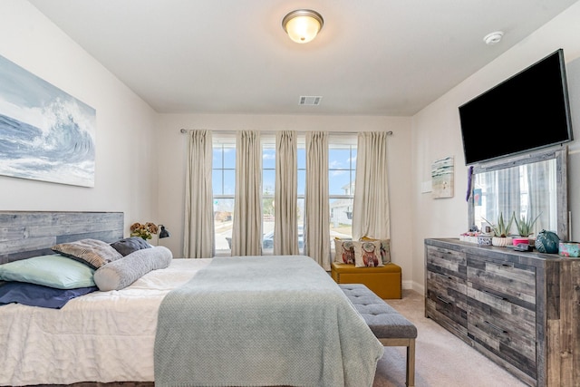 bedroom with light colored carpet