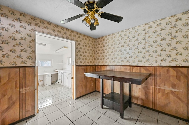 dining space featuring light tile patterned flooring and ceiling fan