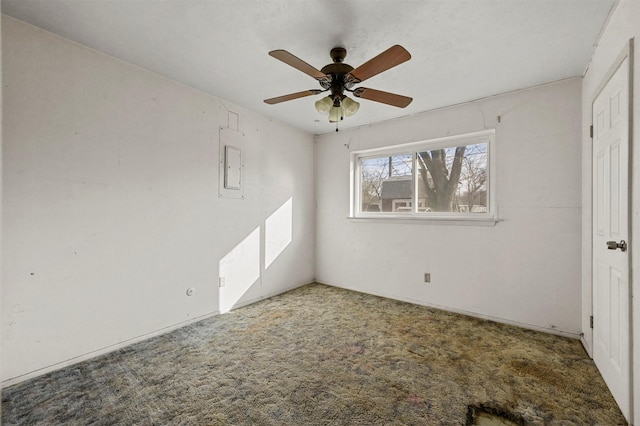 unfurnished bedroom with ceiling fan, electric panel, and carpet