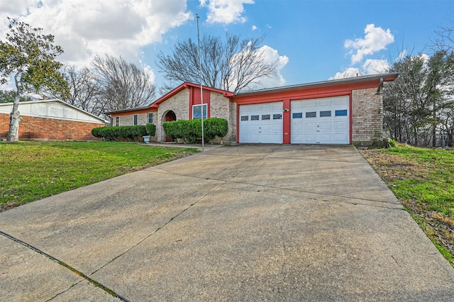 ranch-style house with a garage and a front lawn