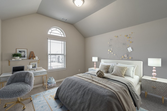 bedroom with lofted ceiling and carpet floors