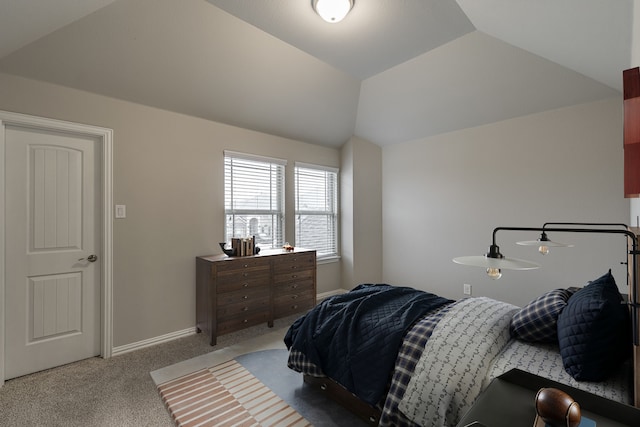 carpeted bedroom featuring lofted ceiling