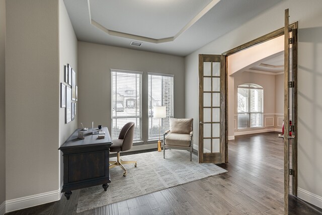 entrance foyer with an inviting chandelier, ornamental molding, and dark hardwood / wood-style floors