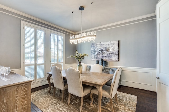 dining space with dark hardwood / wood-style flooring and ornamental molding