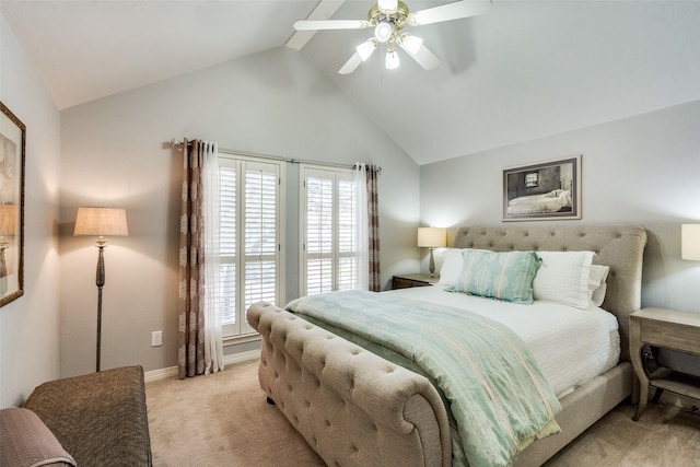 bedroom featuring ceiling fan, light colored carpet, and lofted ceiling