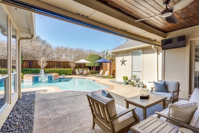 view of swimming pool with an in ground hot tub, a patio, an outdoor hangout area, and ceiling fan