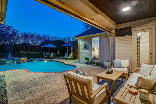 view of pool with an in ground hot tub, an outdoor hangout area, and a patio