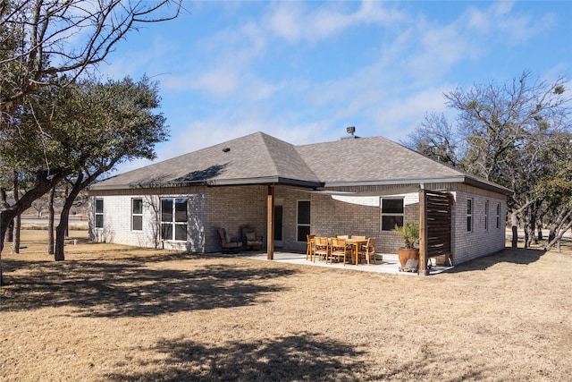 rear view of house with a patio