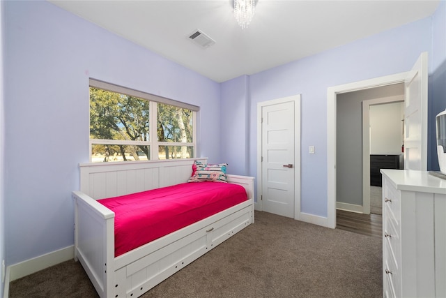 bedroom with dark carpet