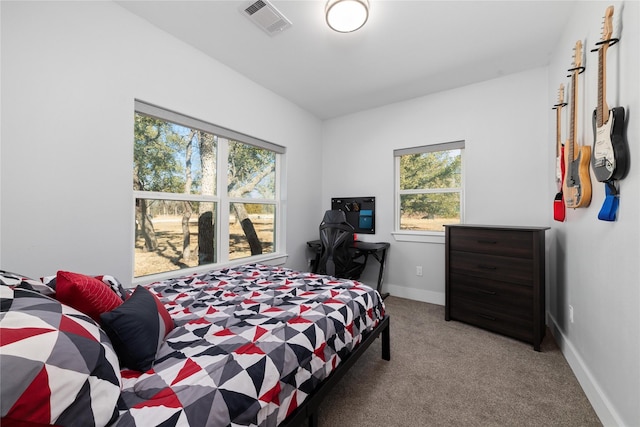 bedroom featuring light carpet