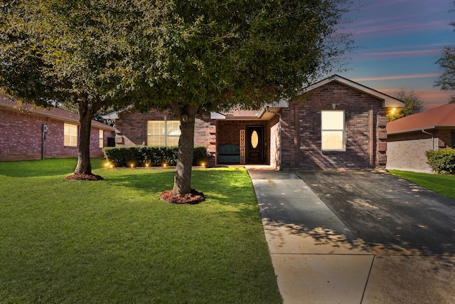 view of front of property with a lawn