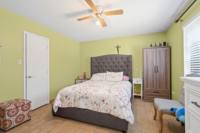 bedroom featuring ceiling fan and light hardwood / wood-style flooring