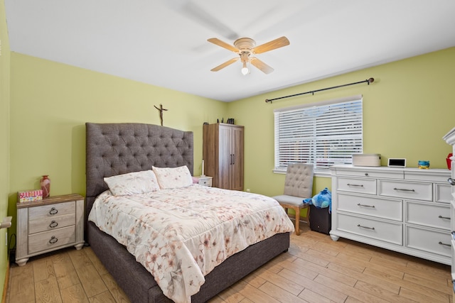 bedroom with ceiling fan and light hardwood / wood-style floors