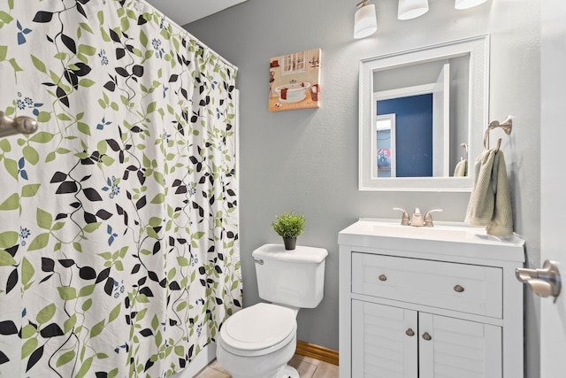 bathroom with vanity, toilet, and a shower with shower curtain