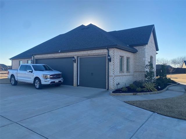 view of side of home with a garage